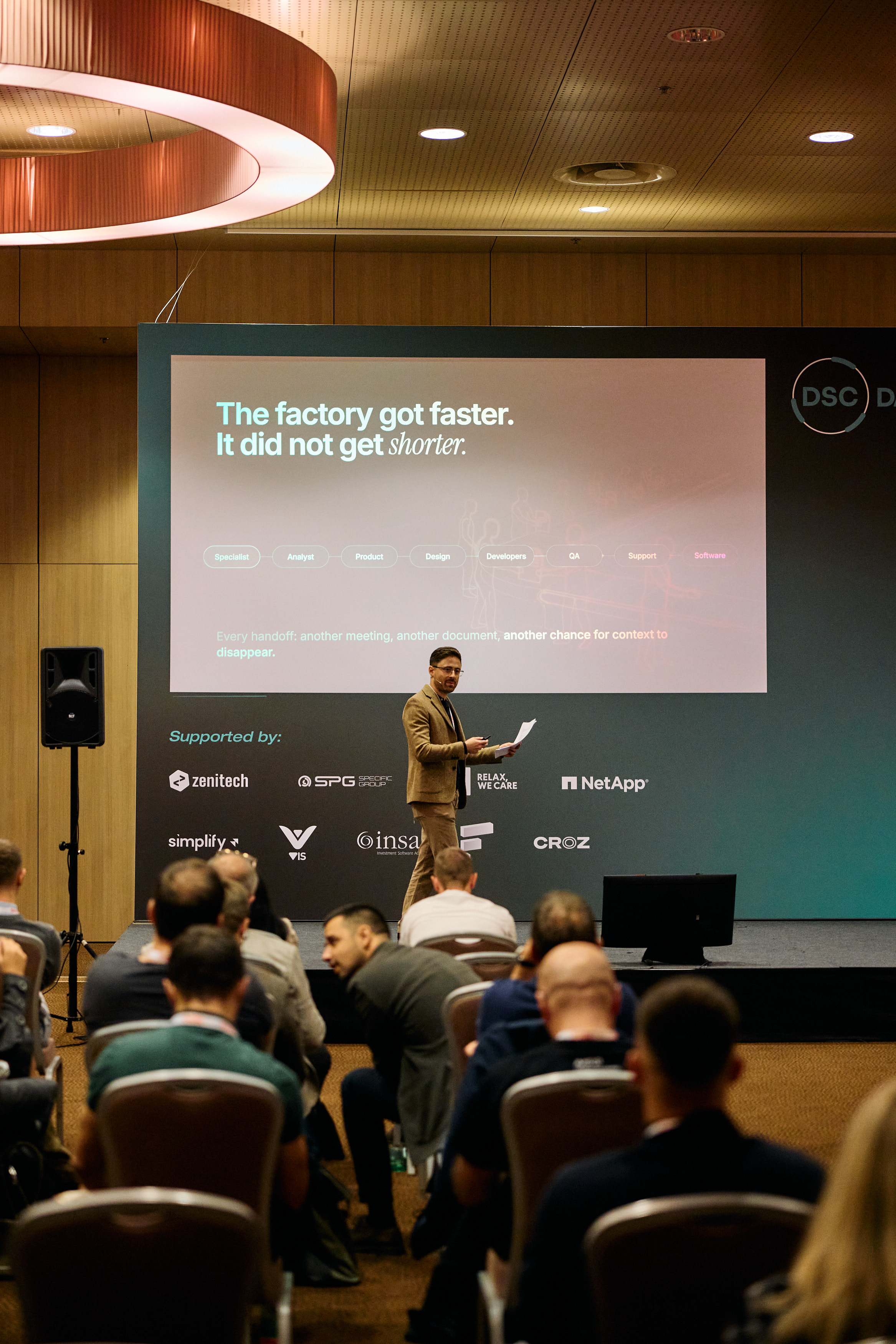 Daniil speaking at DSC DACH, seen over the seated audience